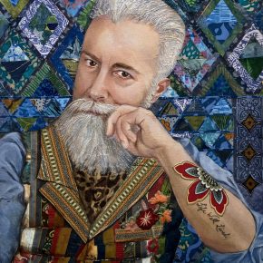 Portrait of a man with a contemplative expression, featuring a textured gray beard, colorful patchwork vest, and a tattoo on his forearm that reads 'Life Well Lived,' set against a vibrant geometric blue and green background.