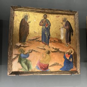 A medieval painting depicting the Transfiguration of Christ, with golden backgrounds and vibrant colors.