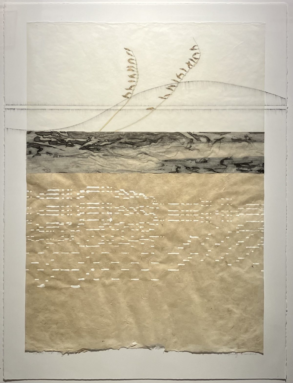 A composition featuring two dried plant stems arching across translucent layered paper above a section of musical roll paper and an abstracted ground.