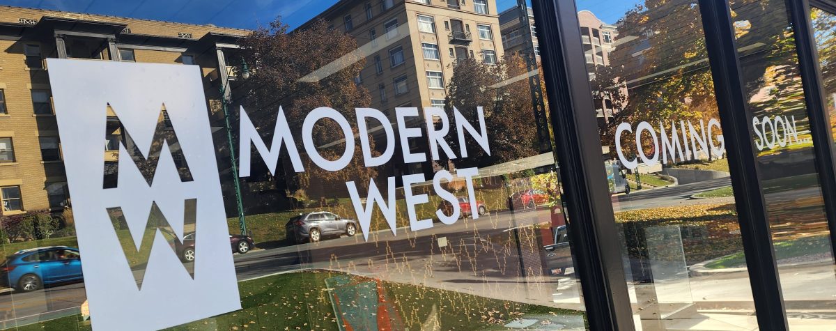 close-up of Modern West logo and “Coming Soon…” lettering applied to the glass front of the new gallery